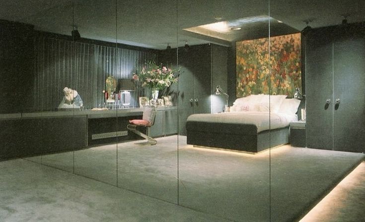 A Home With a Sunken Living Room and a Mirror Wall