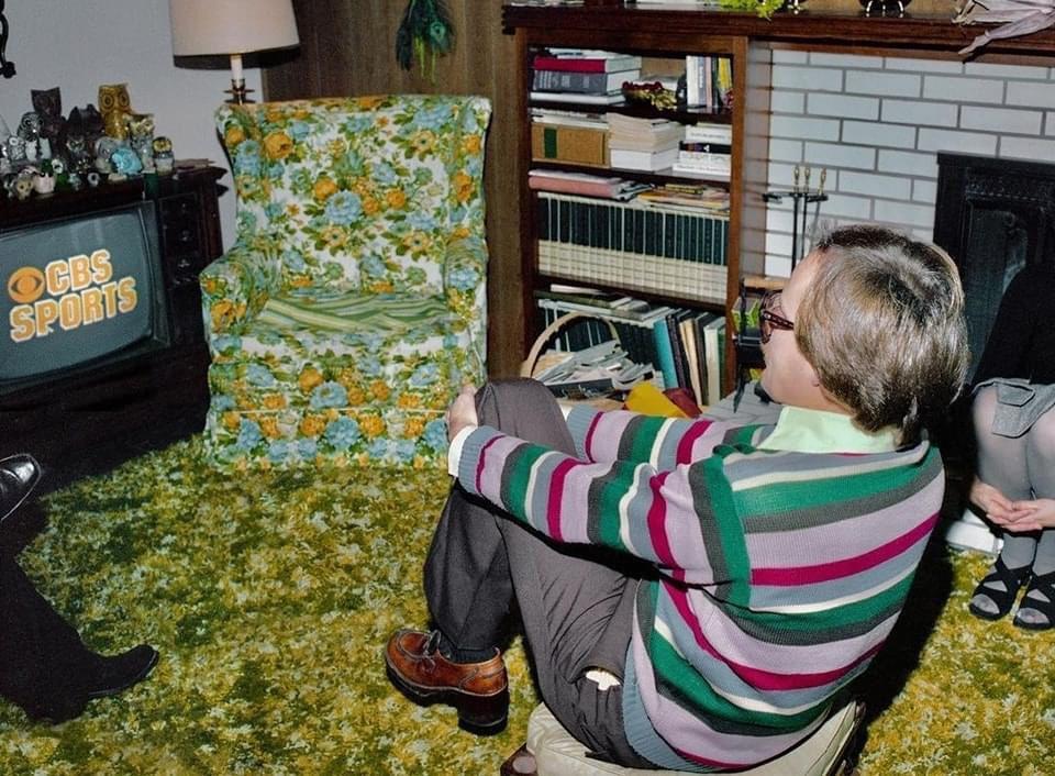 Carpet, floral chairs, and game day vibes.