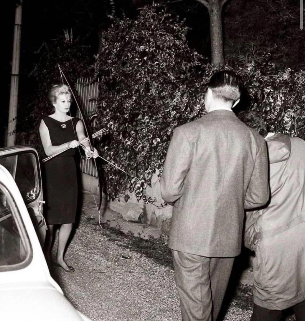 Anita Ekberg Greets Paparazzi with a Bow, 1960