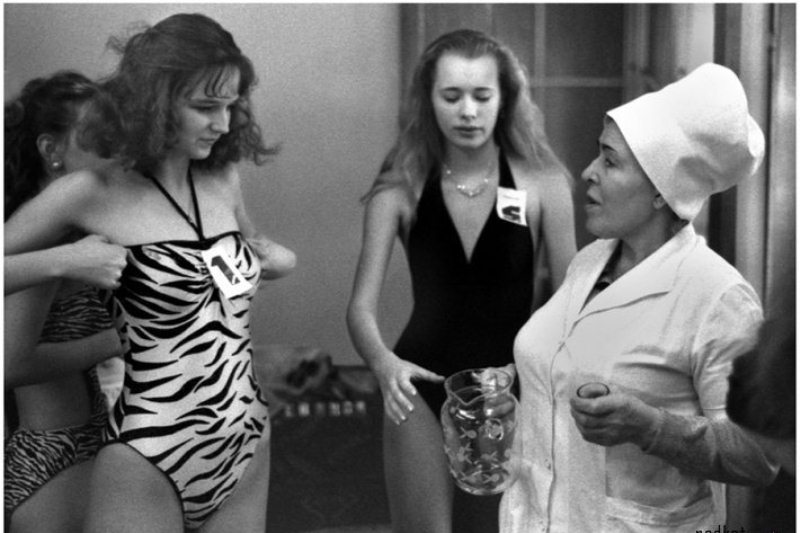 A nurse inspecting contestants in Miss Soviet Union pageant in 1988.