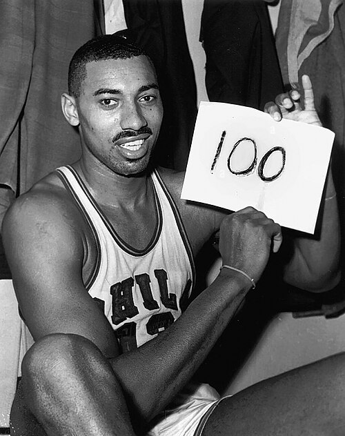 Wilt Chamberlain holding “100” sign after breaking the record in 1962.