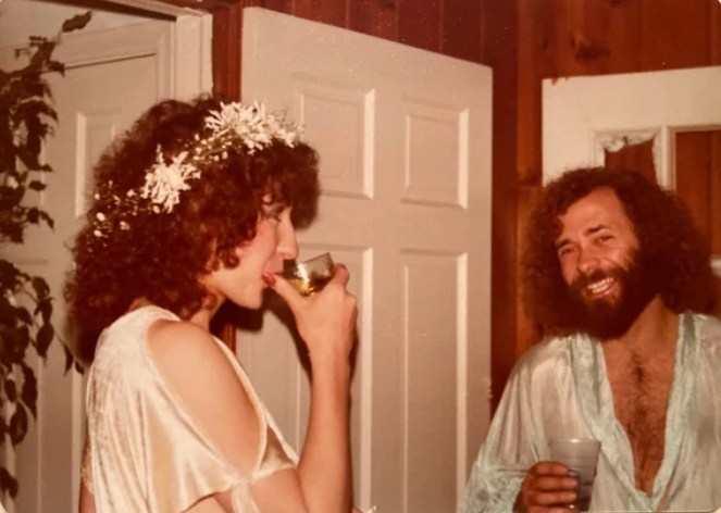 Beard. Flower Crown. Champagne. 1978 Wedding or Coachella Cult?