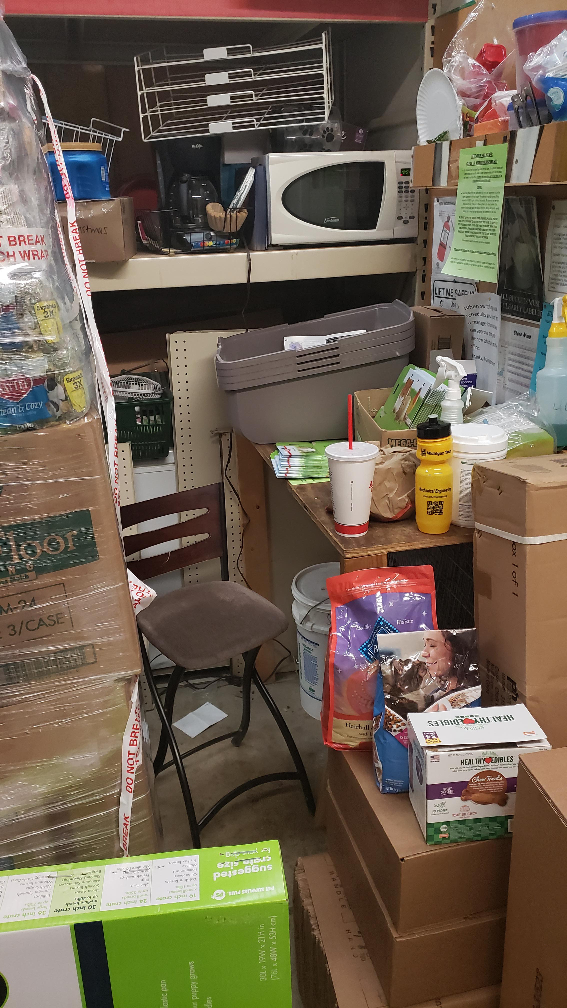 A maze of boxes with a microwave somewhere in the middle.