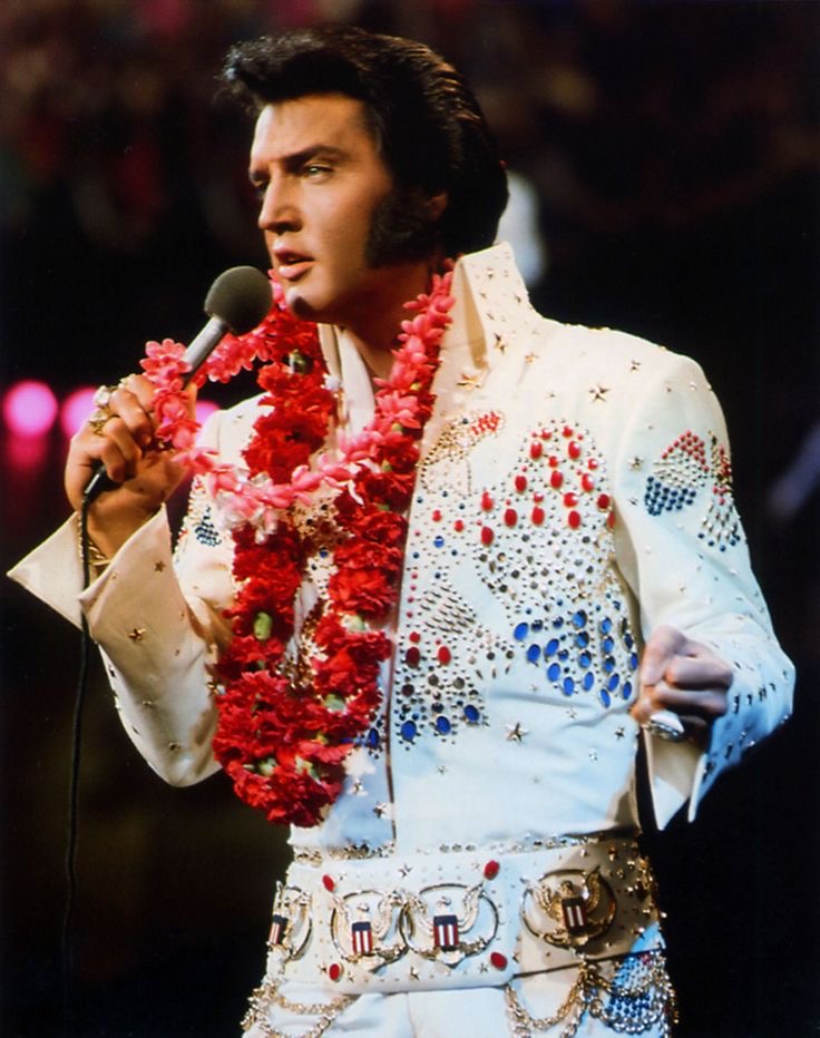Elvis Beamed from Hawaii In a Jumpsuit Covered in America
