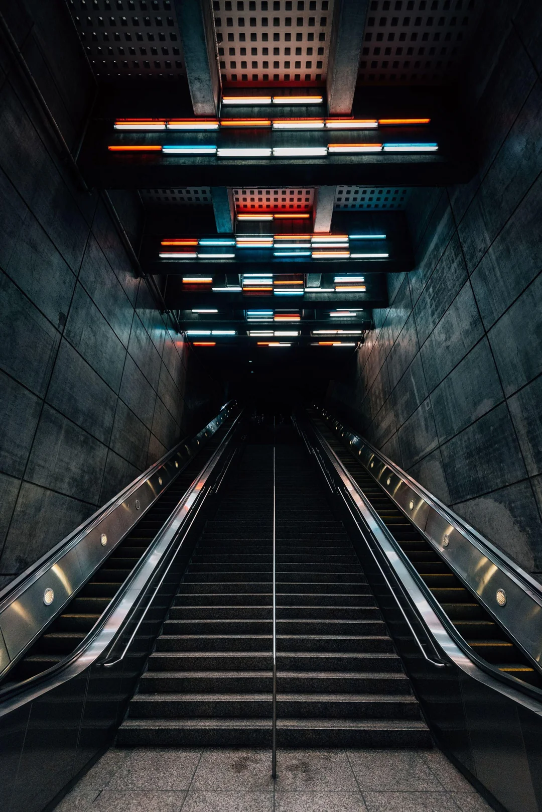 Escalators waiting for a traveler who never comes.