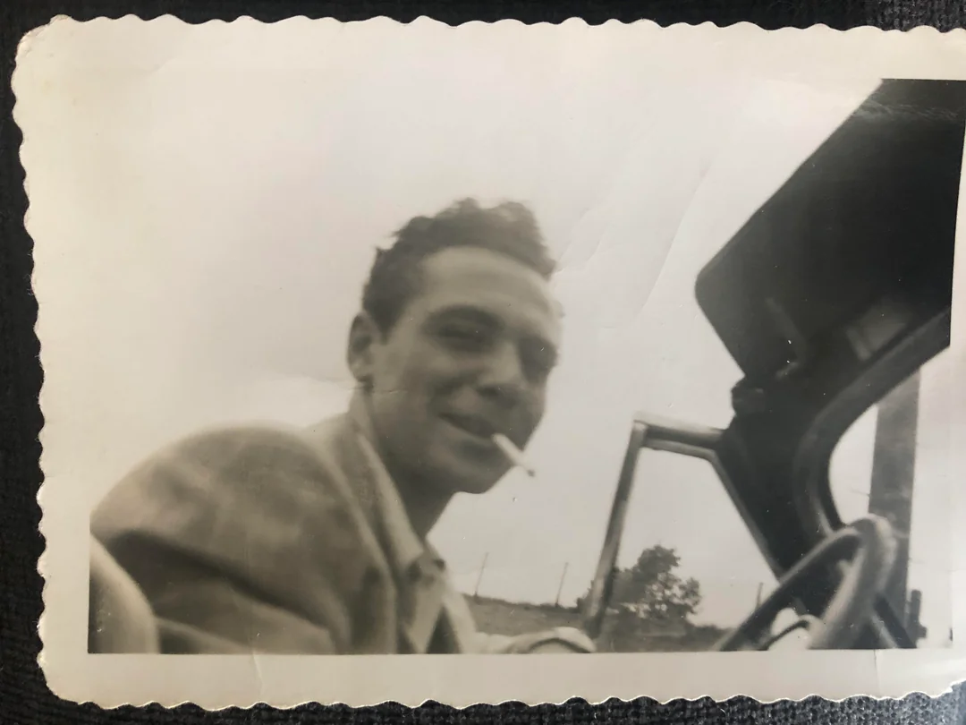 Cigarette, smirk, open road.