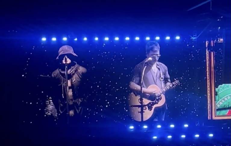 Two brothers, one stage, and the galaxy watching.