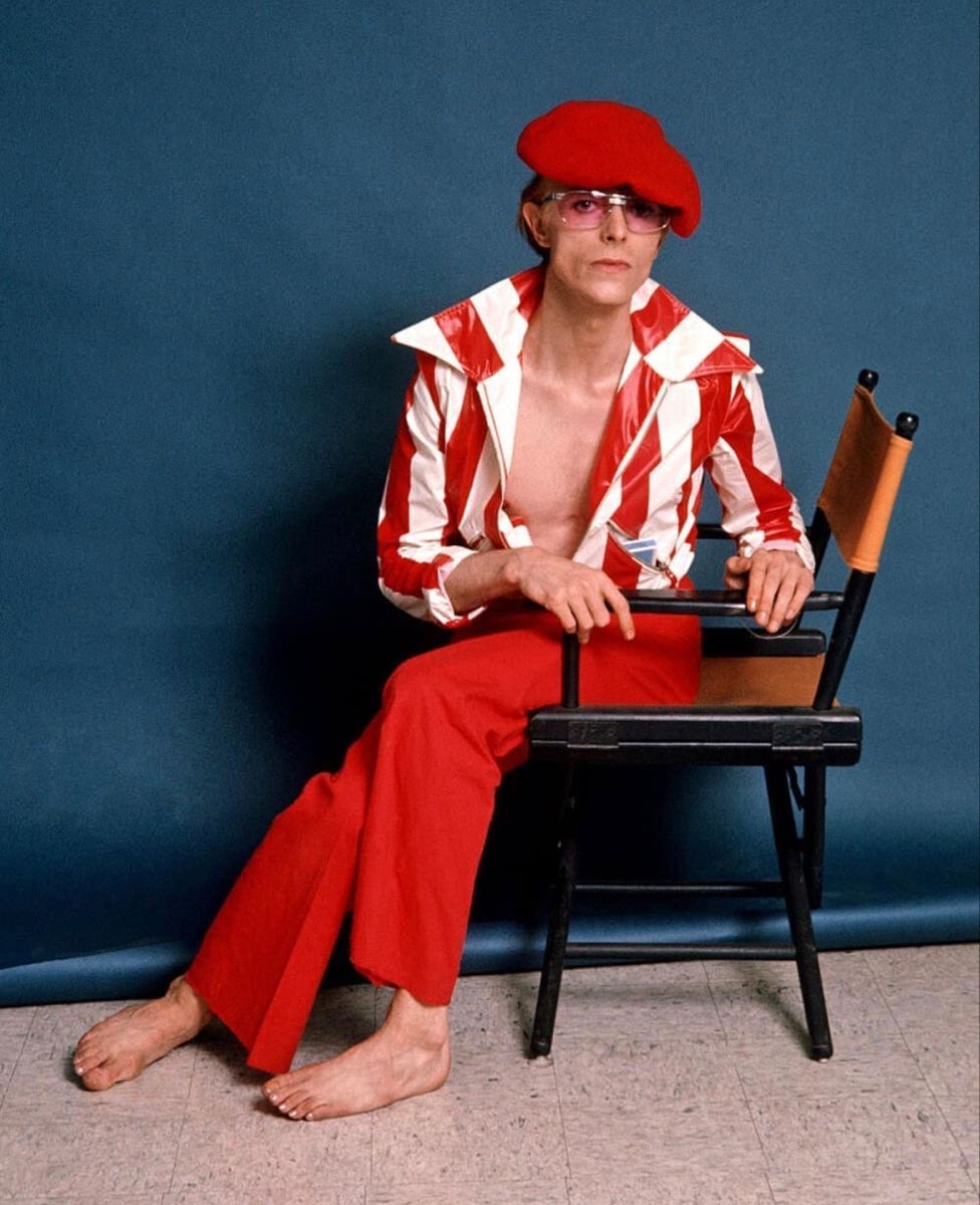 Red Hat, Red Pants, Jacket Open Like a Promise