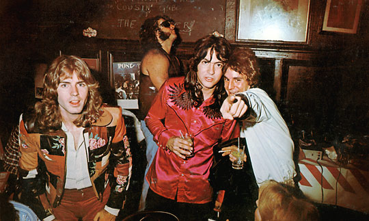 A rare candid of the band cutting loose offstage.