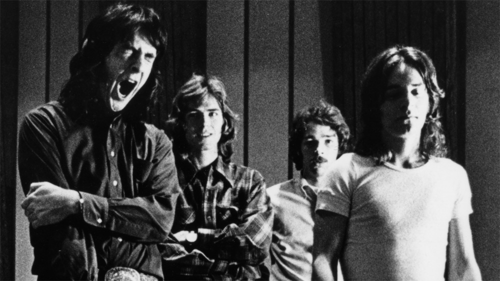 Four young musicians balancing ambition and mischief.