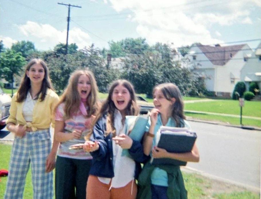 First-day giggles with folders in hand.