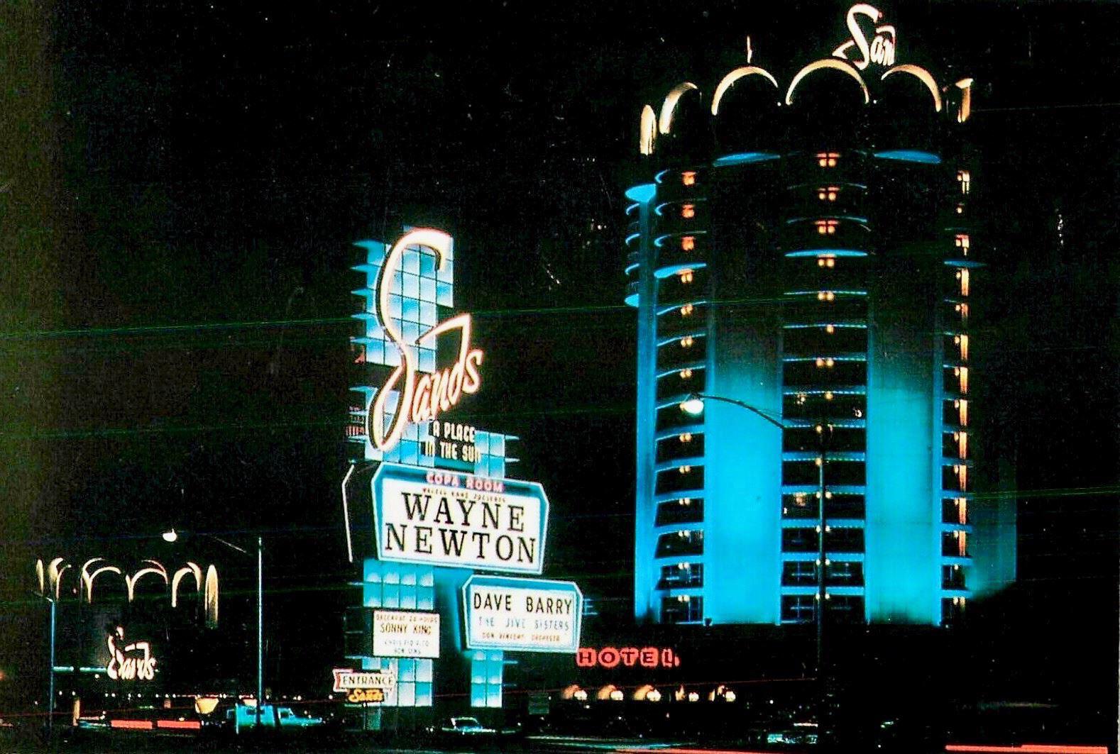 The Sands Hotel glowing in blue neon.