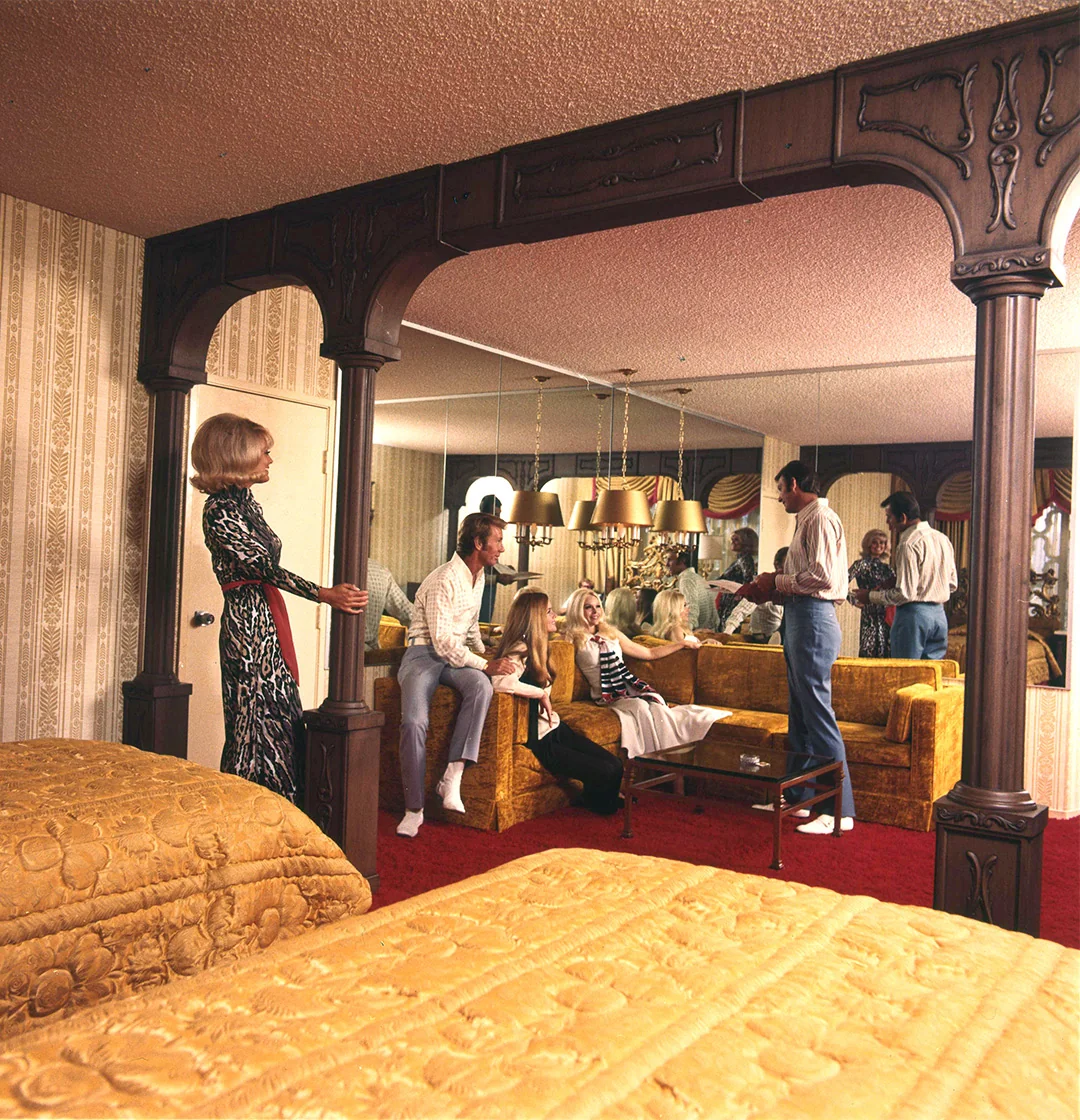 Bold prints, gold tones, and mirrored walls, Vegas hotel rooms were as loud as the casinos.