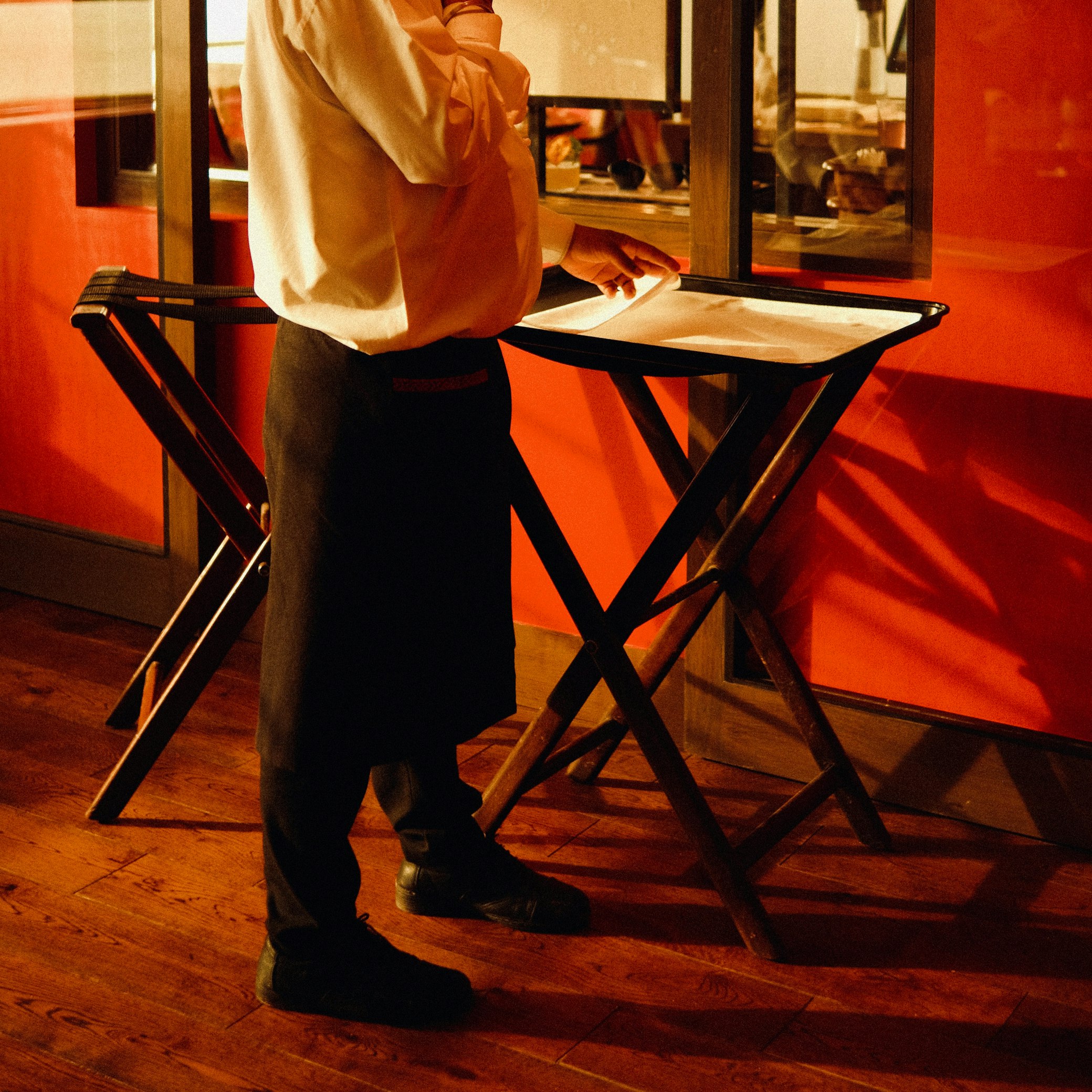 As a restaurant host, my manager wanted me to host, clean tables, and serve drinks all at once. I finally yelled at her in front of customers. She fired me the next shift.