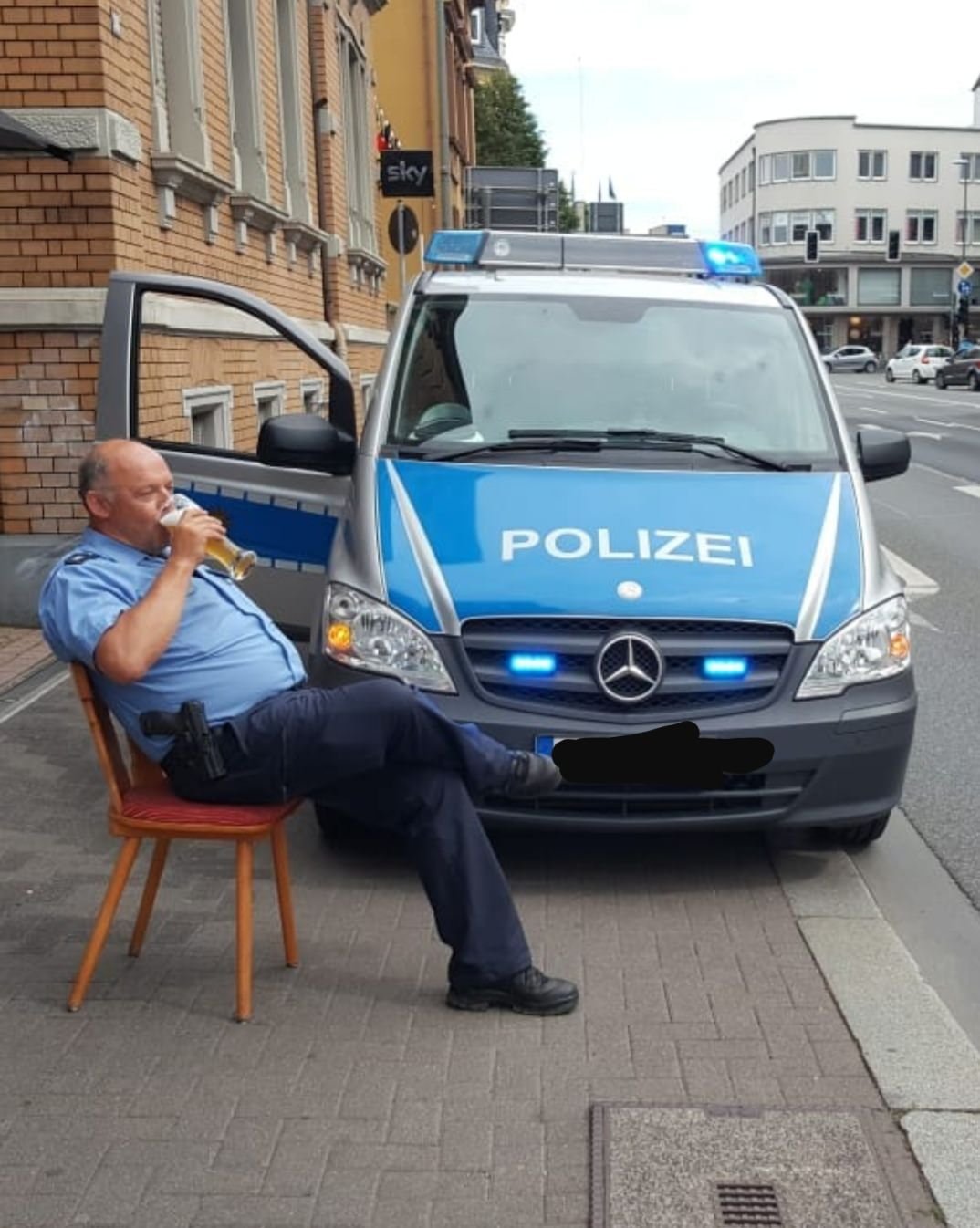 The German cops in their natural state: blending law enforcement with refreshments.