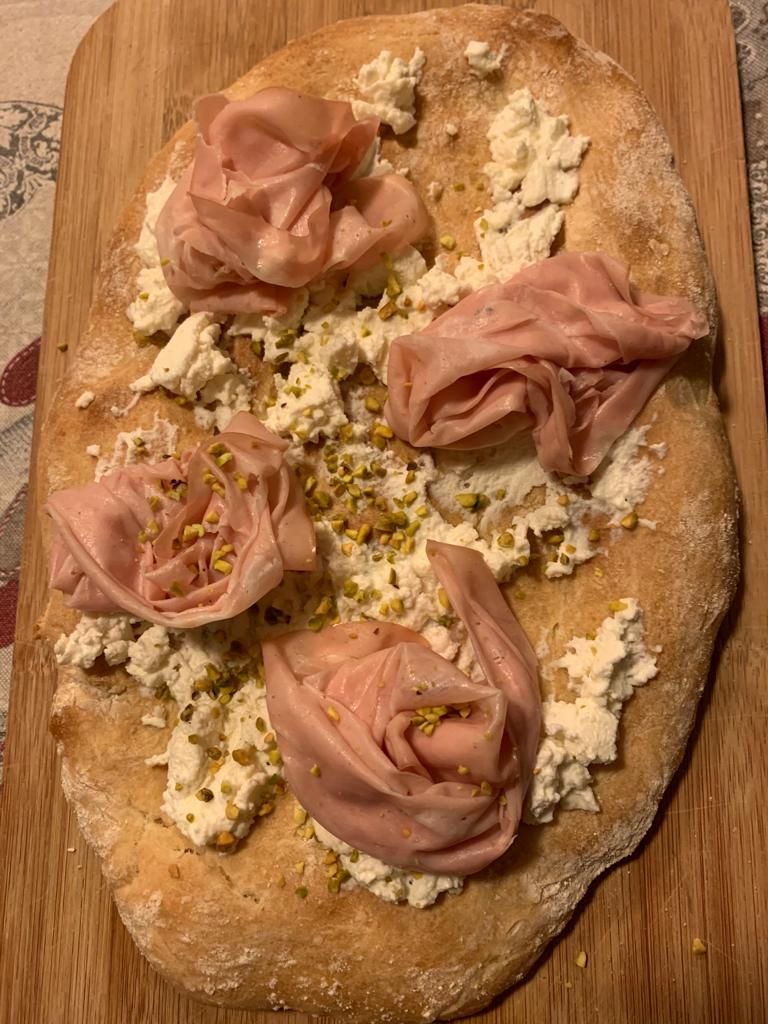 First Written Mention of “Pizza”: 997 CE