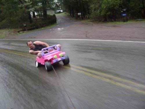 Man Gets Towed Through Town… By a Toy Car