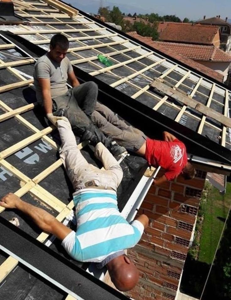 Man Holding Two Other Men by the Ankles: Engineering Level = NO