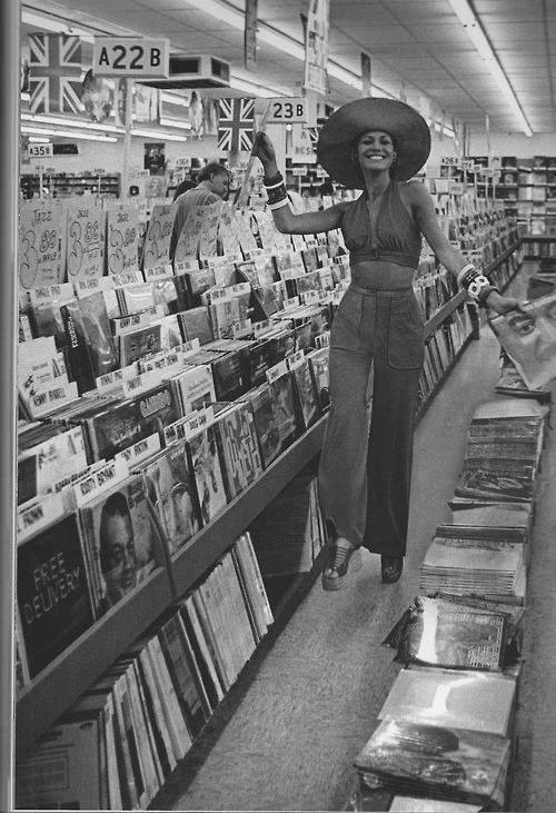 Rows of colorful LPs invited hours of flipping, debating, and showing off your latest finds.