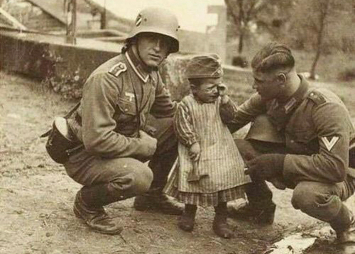 German Soldiers Comfort a Child, 1939 Poland