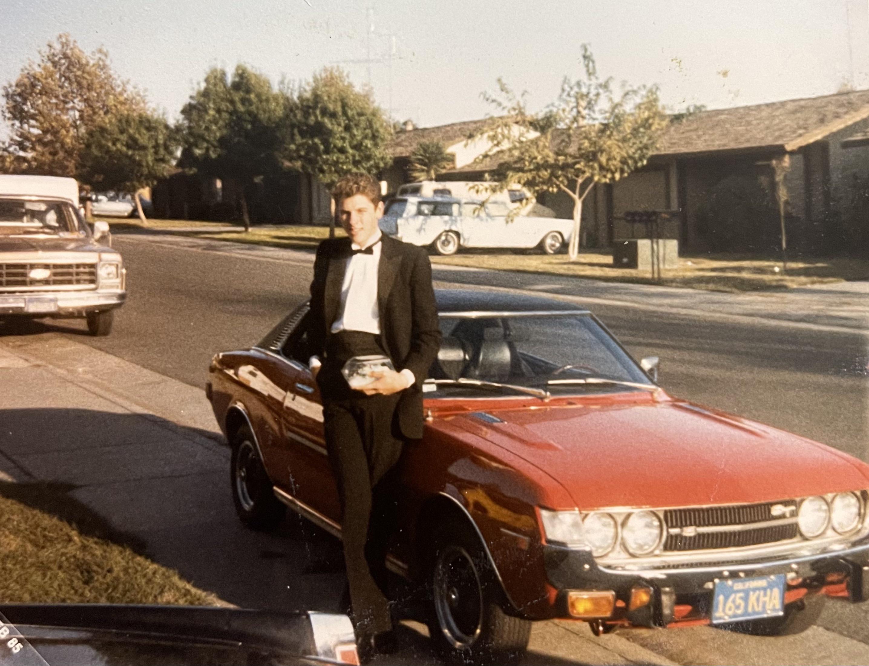 Nothing said cool quite like looking sharp in front of a car.