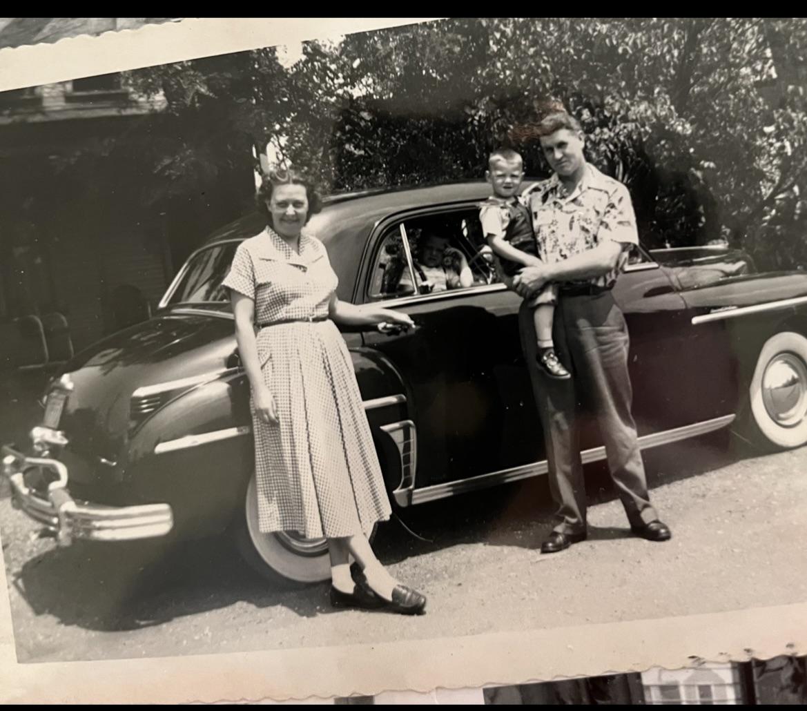 Proof that in every family portrait, the car counts as another child.