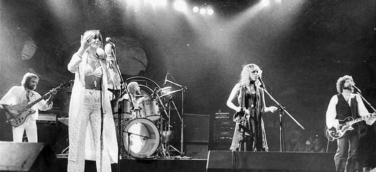 Fleetwood Mac performing together at the peak of their career, their chemistry and tension both driving the music and captivating audiences.