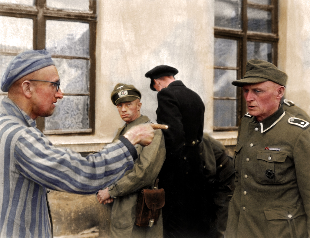 Liberated prisoner confronts guard, 1945