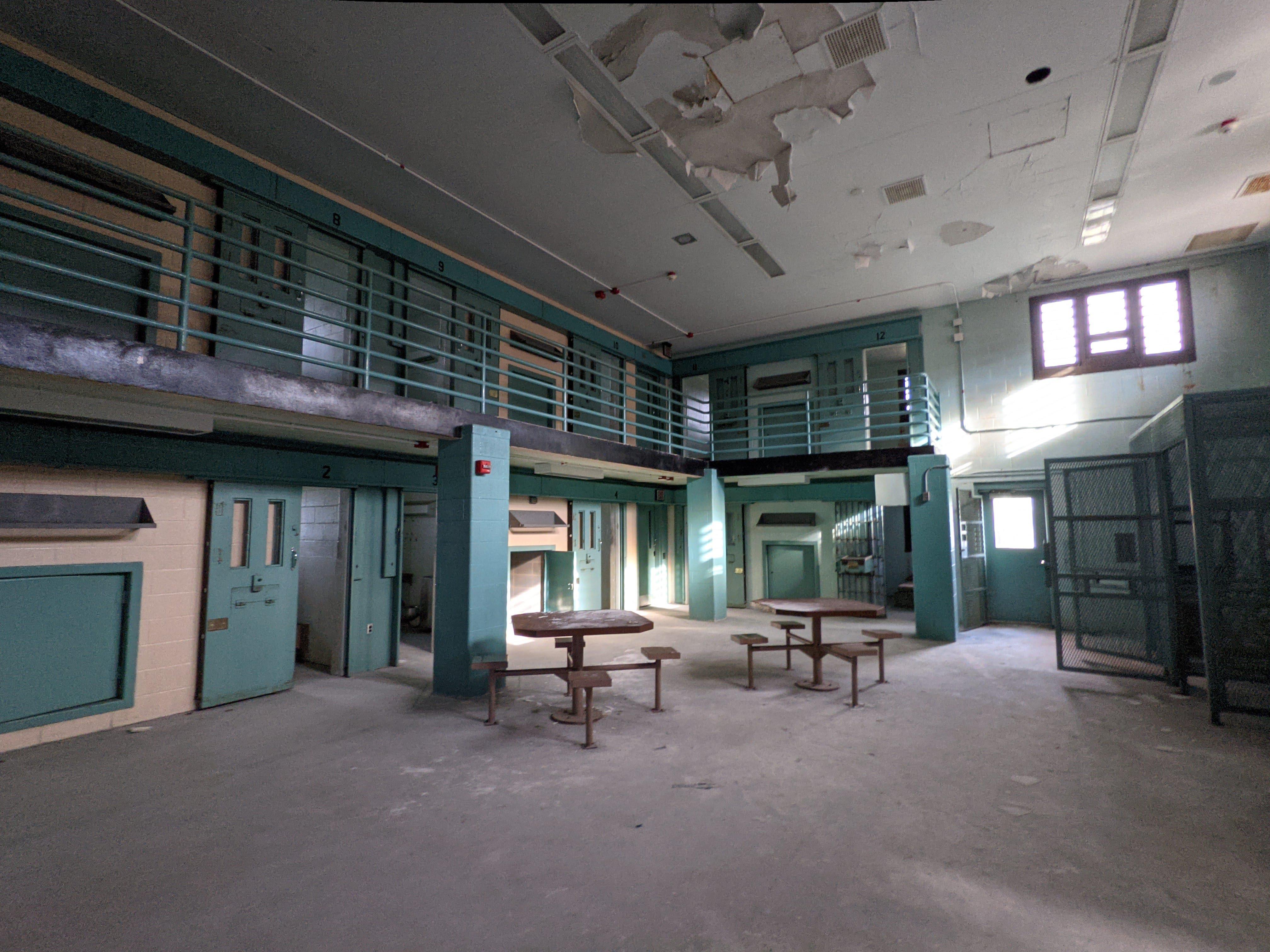 Rows of cells stand silent in a now closed facility.
