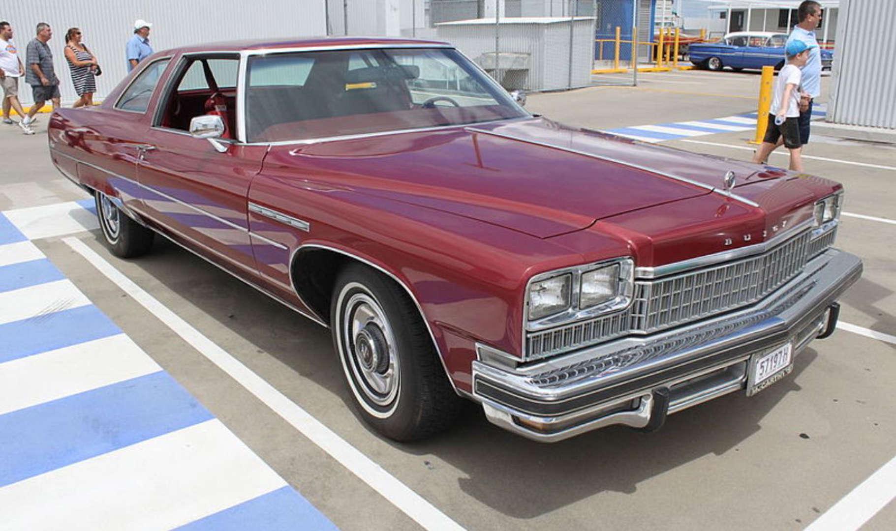 Burgundy Buick Electra land yacht with enough chrome to blind the sun.