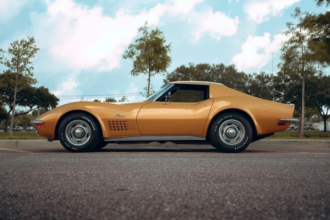 A gold Stingray Corvette ready to cruise into a sunset soundtrack.