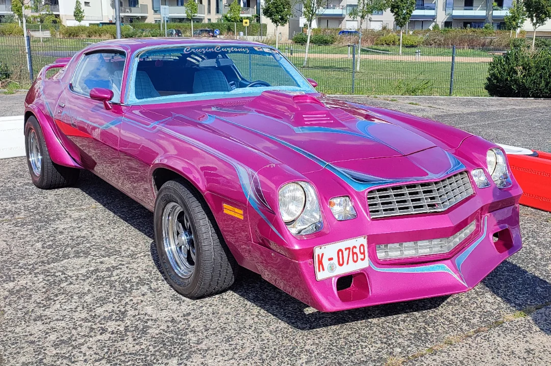 Metallic magenta and stripes so wild they belong on a Funkadelic album cover.