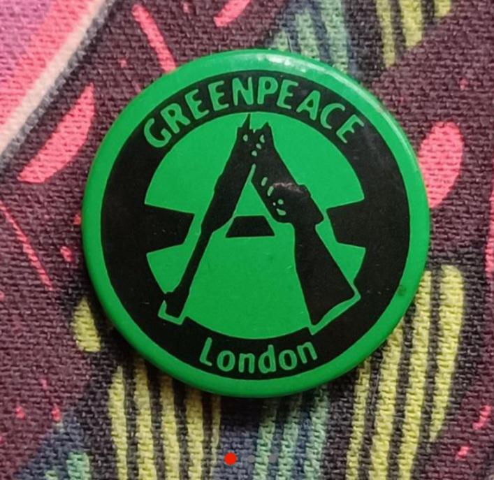 Buttons like this spread the message and identity of Greenpeace as an activist force unafraid of direct action.