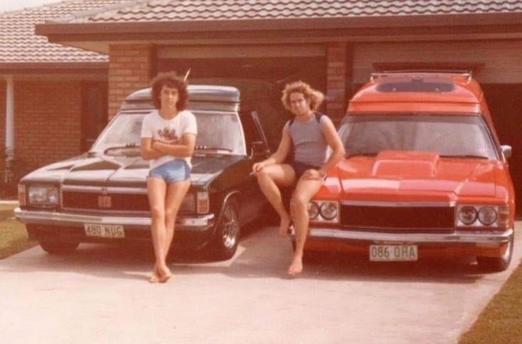 Two Dudes with Their Cars