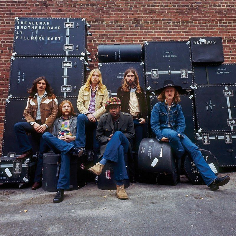 Outside the Fillmore East, posing with their road cases before recording one of the greatest live albums in rock history.