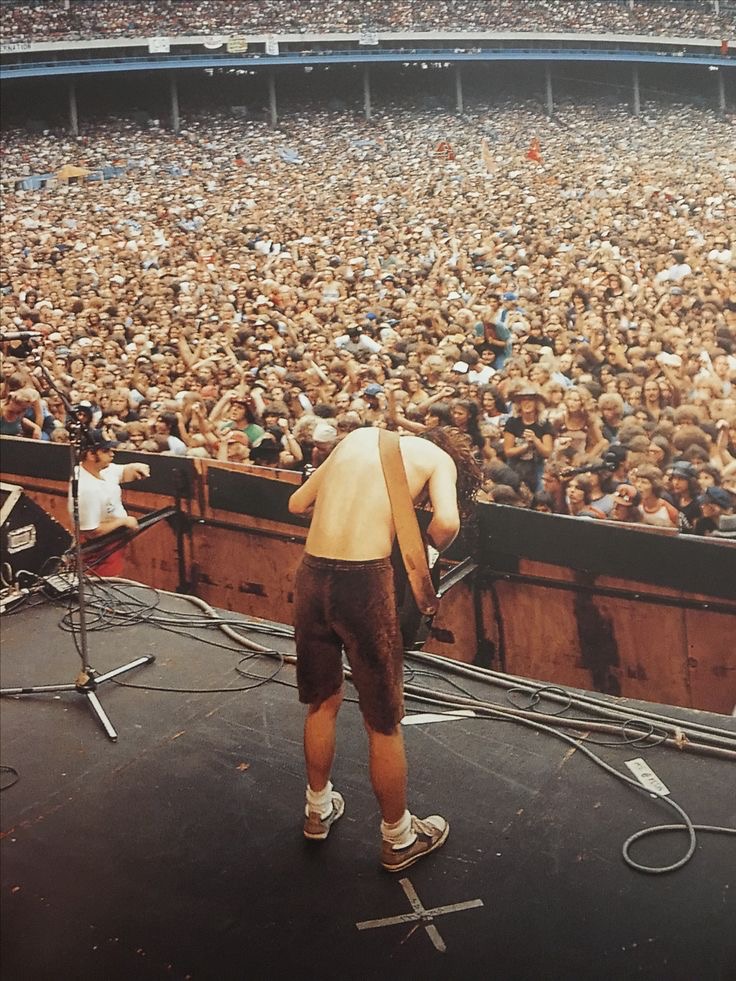 Fans Waving Lighters and Fists