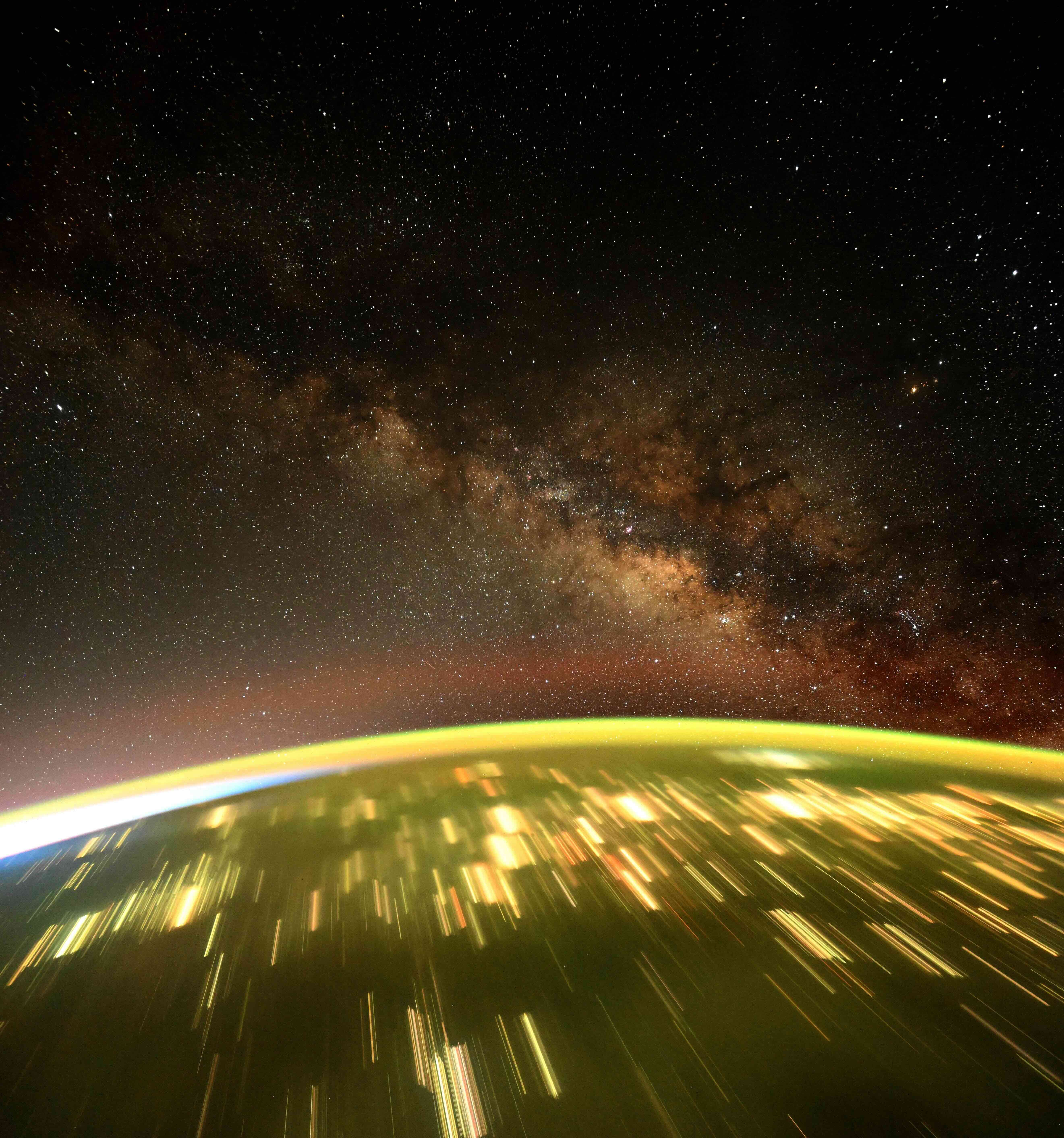 City lights doubling as galaxies.