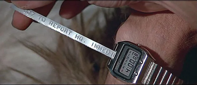 James Bond-style. The ultimate flex would be a digital watch that prints messages.