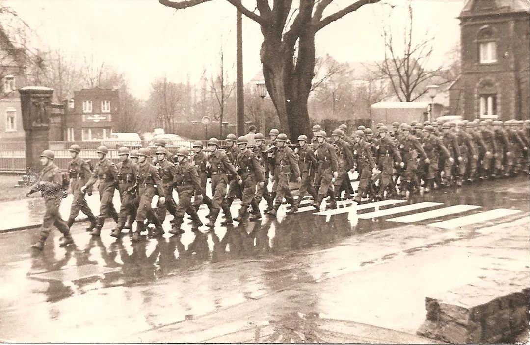 In the rainy streets, disciplined even in tough times.