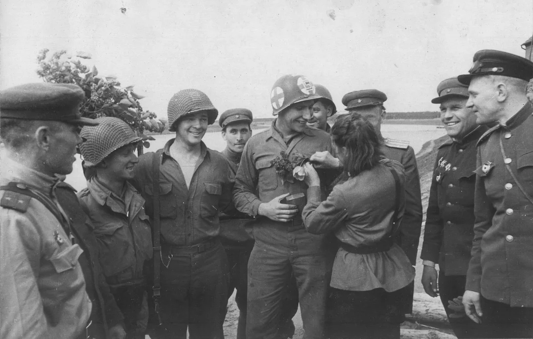 Soviet and American troops share a moment.