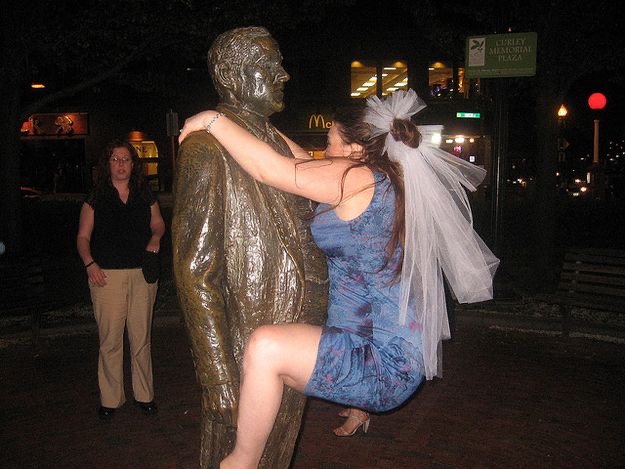 Drunk Bride Rides a Statue. Groom Reconsidering Everything.