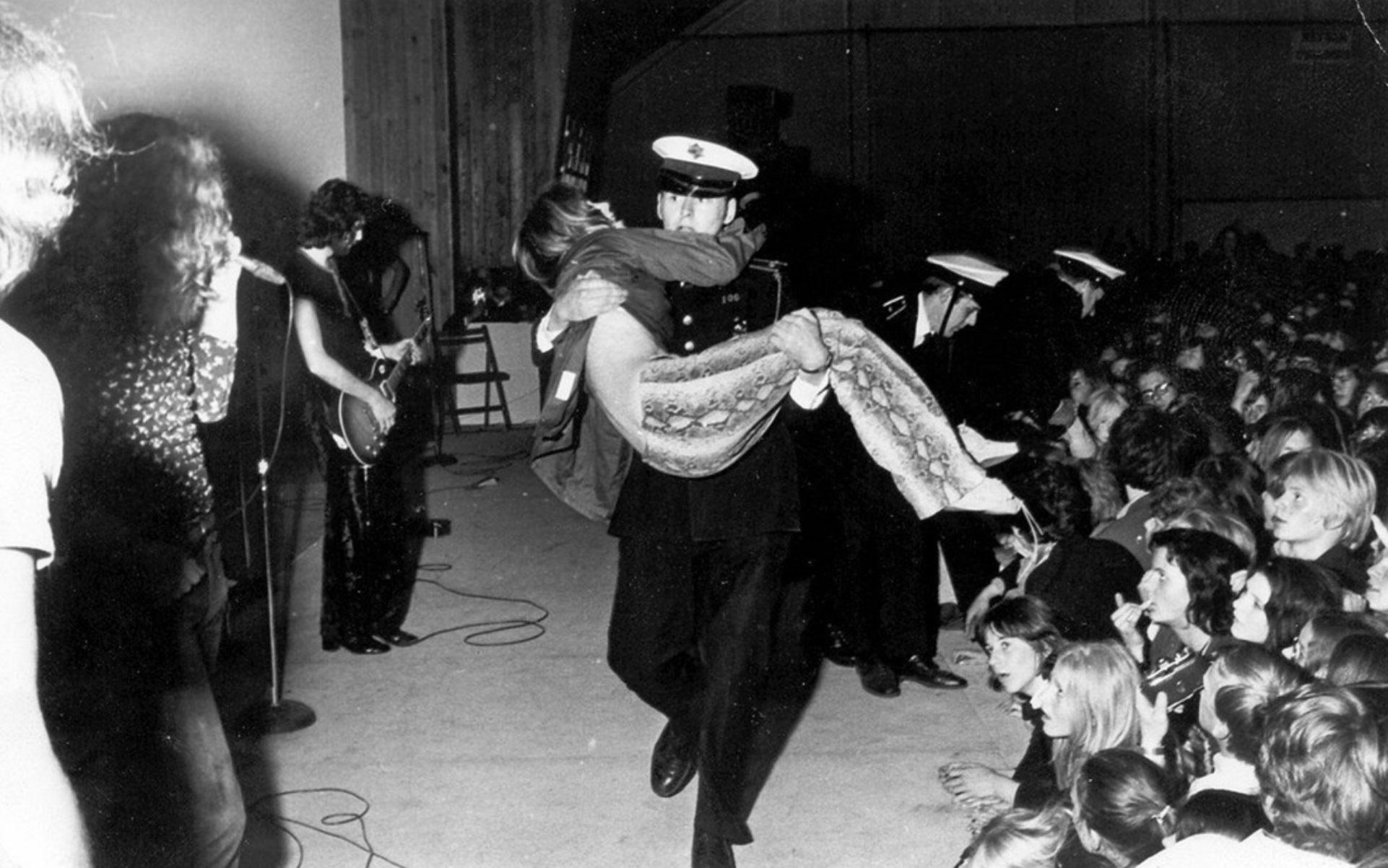 You know it's a Led Zeppelin show if they're carrying a passed out fan.