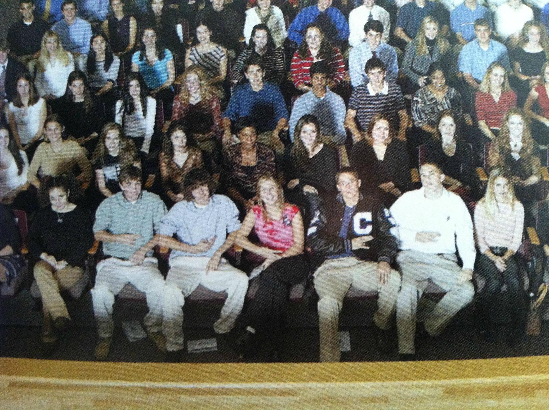 A row full of confidence and forced smiles.