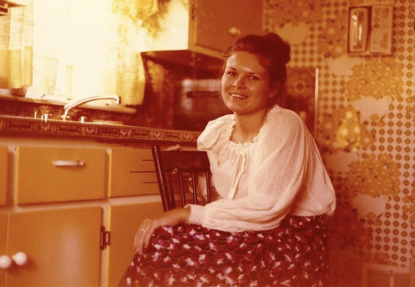 A smile brighter than the wallpaper.