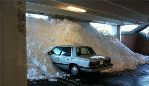 Snow Enters Parking Garage, Buries a Car in Regret