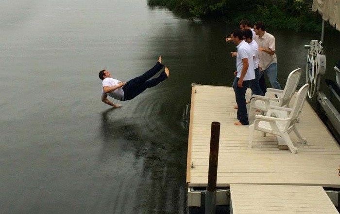 Man Mid-Fall into Water, Dignity Not Invited
