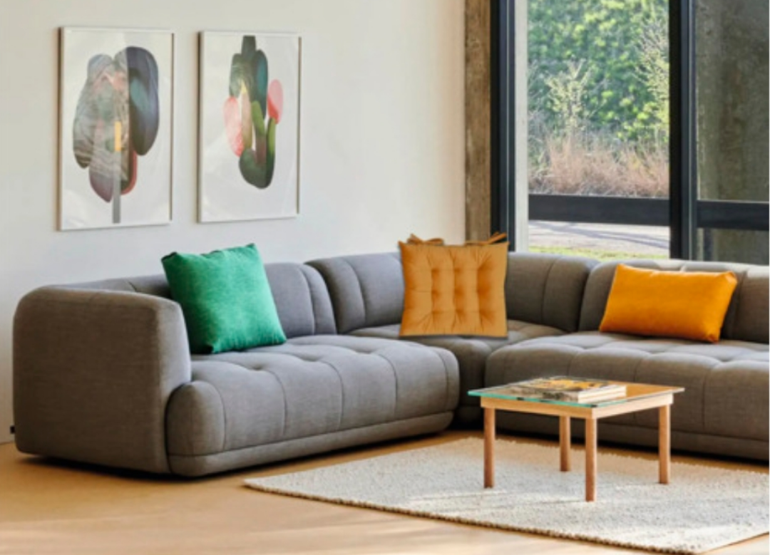A minimalist living room, featuring a pillow from a different ad.