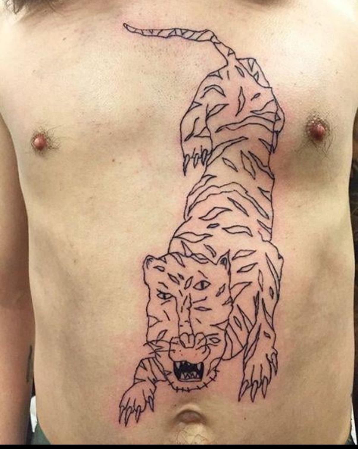 Confused-looking character tattoo