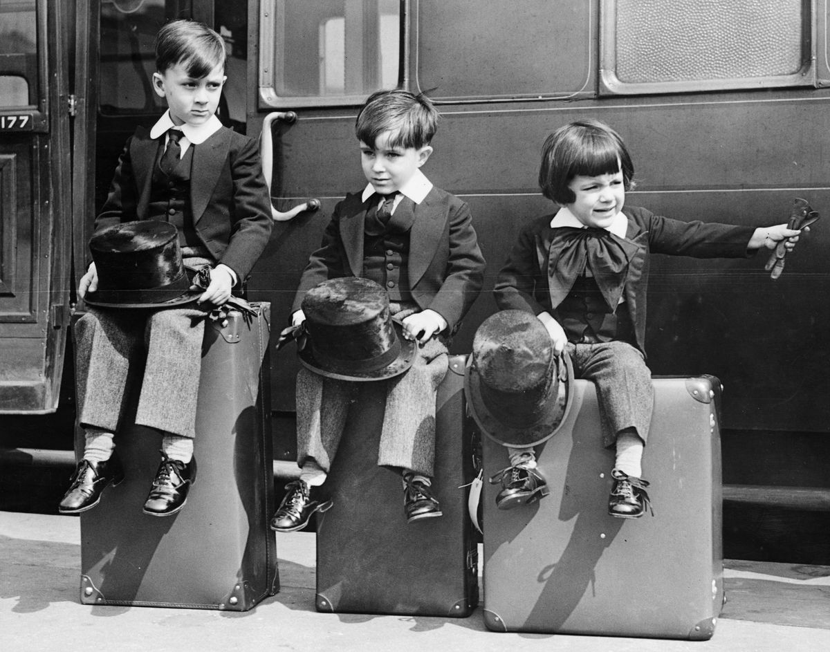 Three little kids, just waiting for their call.