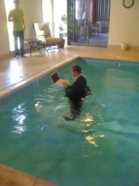 Suit and Computer in the Pool